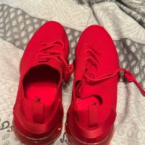 Girl’s Size 1 red tennis shoes.